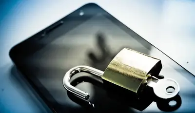 Padlock resting on a smartphone illustrating end-to-end encryption