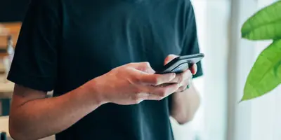 Person texting on an Android phone